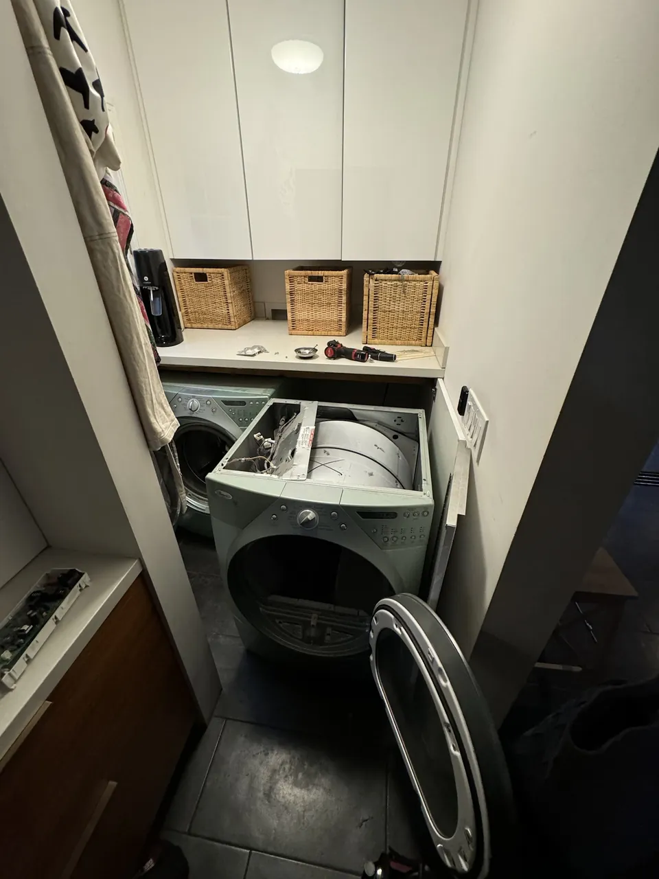 Front-load dryer with the top panel off and the control board removed