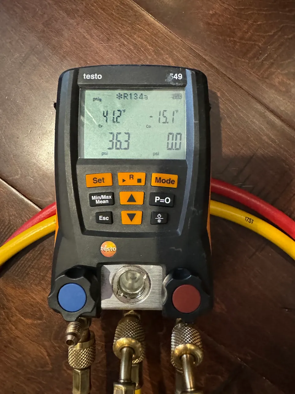 Digital refrigerant manifold gauge showing pressure readings