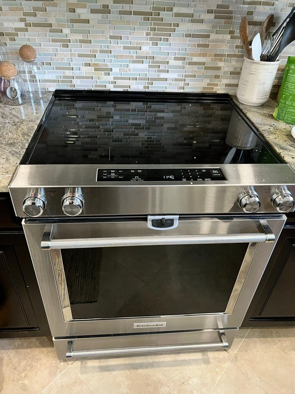 Stainless glass-top electric range with the control panel on the front