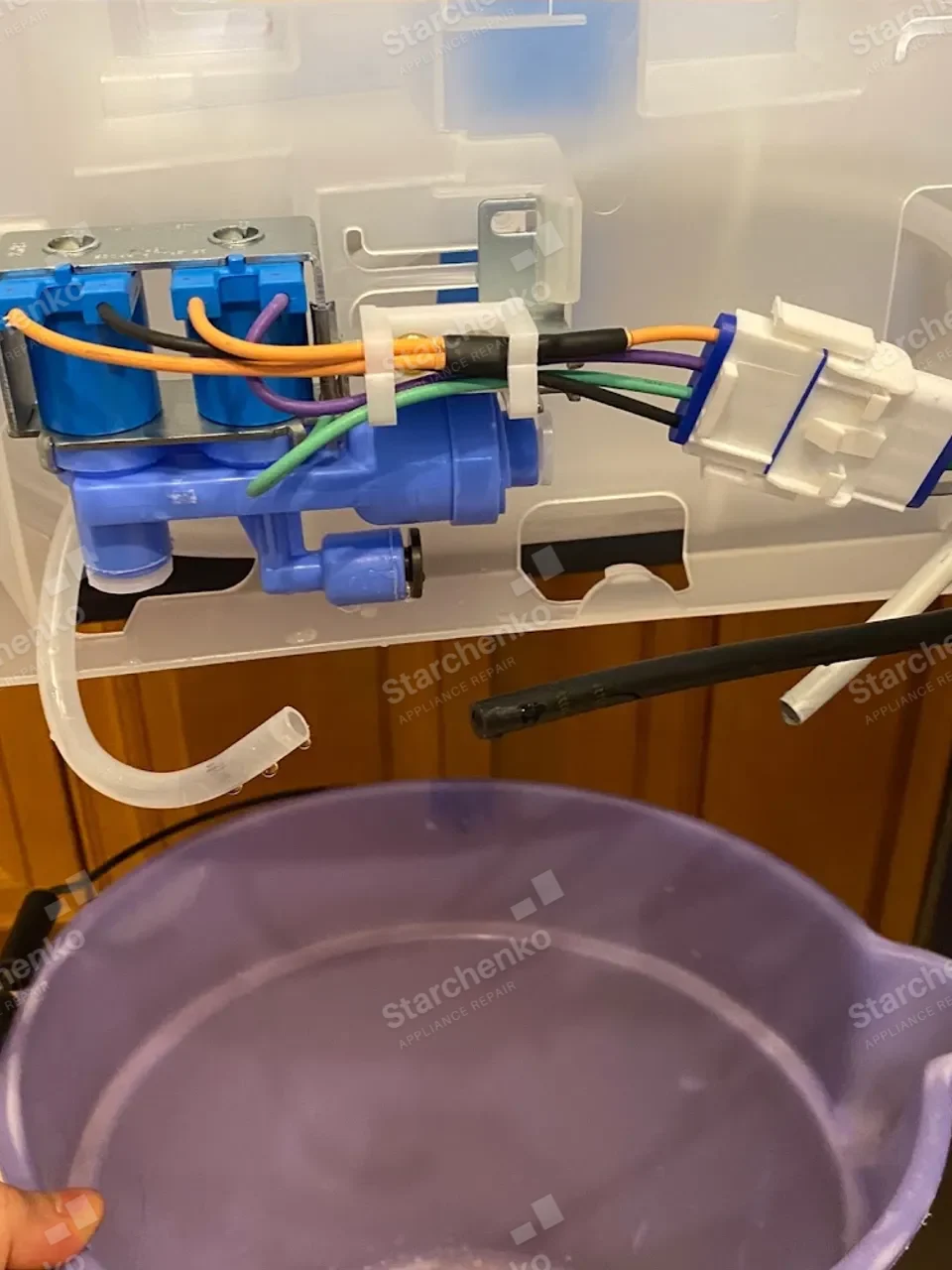 GE Profile ice maker water inlet valve assembly with the supply tubing attached