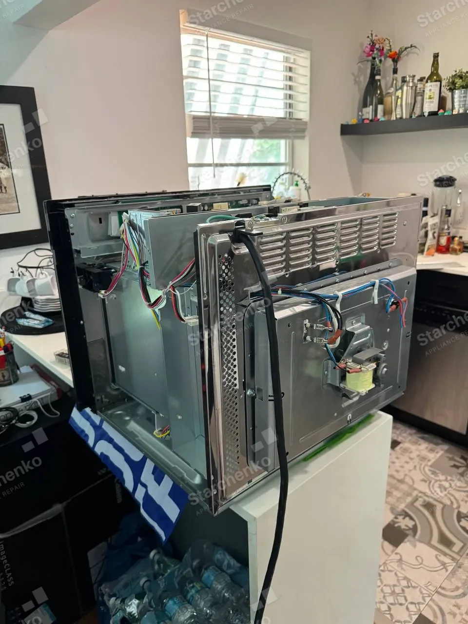 LG convection oven taken apart with the back panel off and wiring exposed