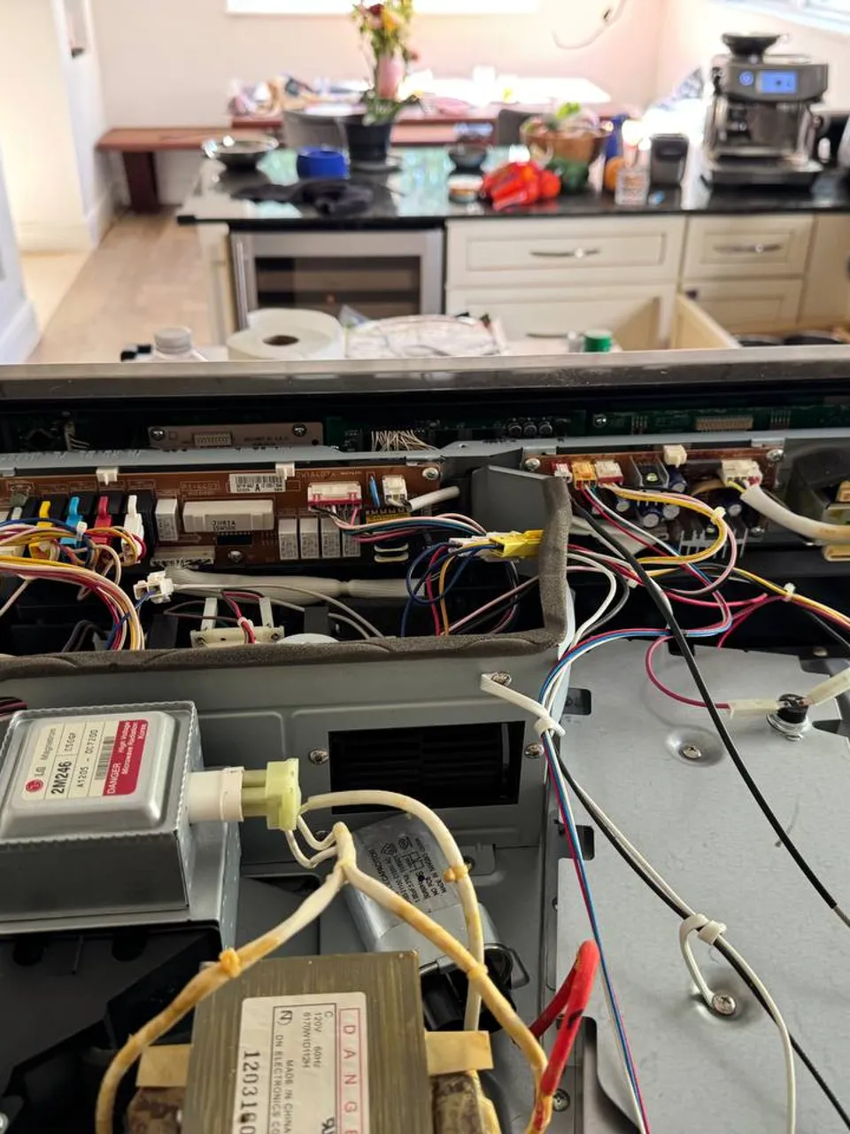 Microwave opened up with the magnetron and high-voltage transformer exposed