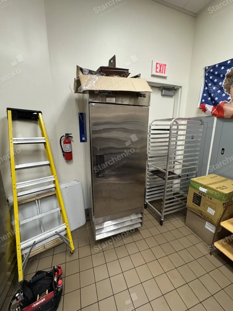 True commercial reach-in cooler in a bakery back room