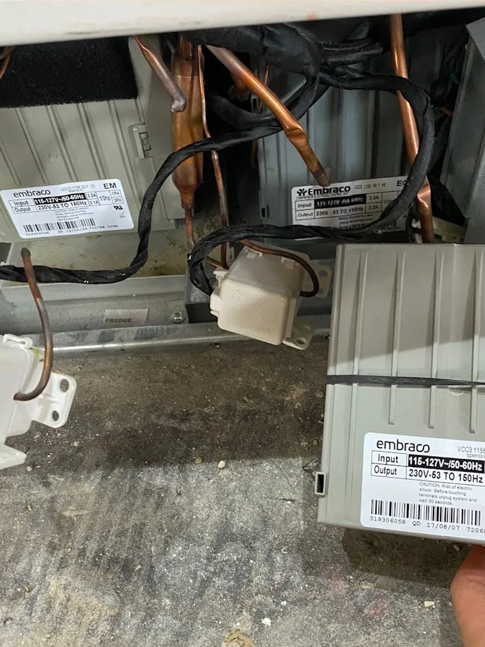 Refrigerator compressor inverter boards taken out of the machine compartment