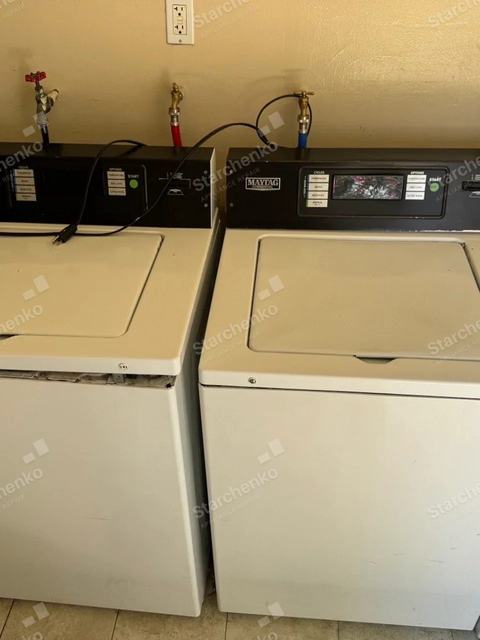 Two Maytag commercial washers with card payment readers built into their control panels