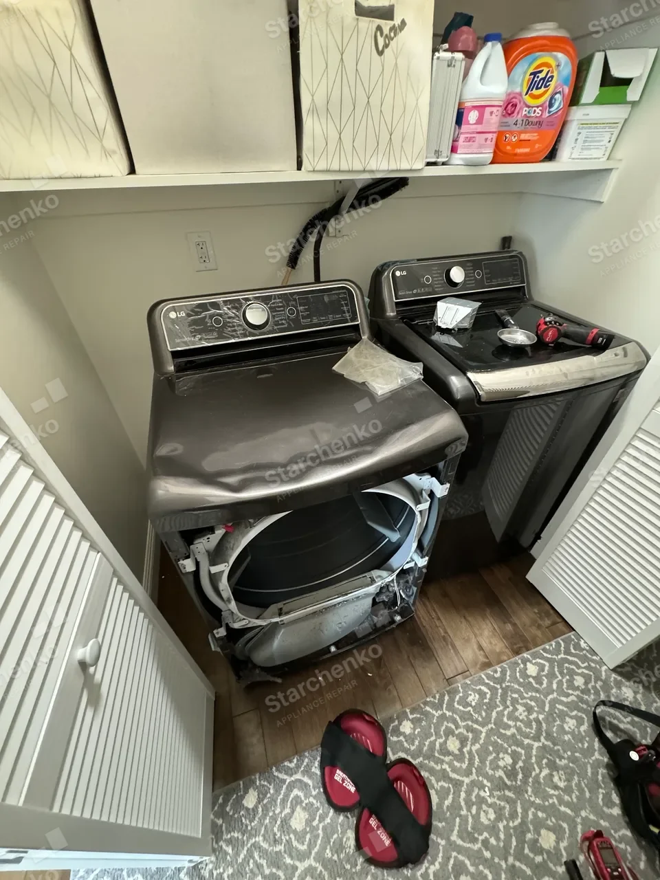 LG dryer with the front and top panels removed for replacement