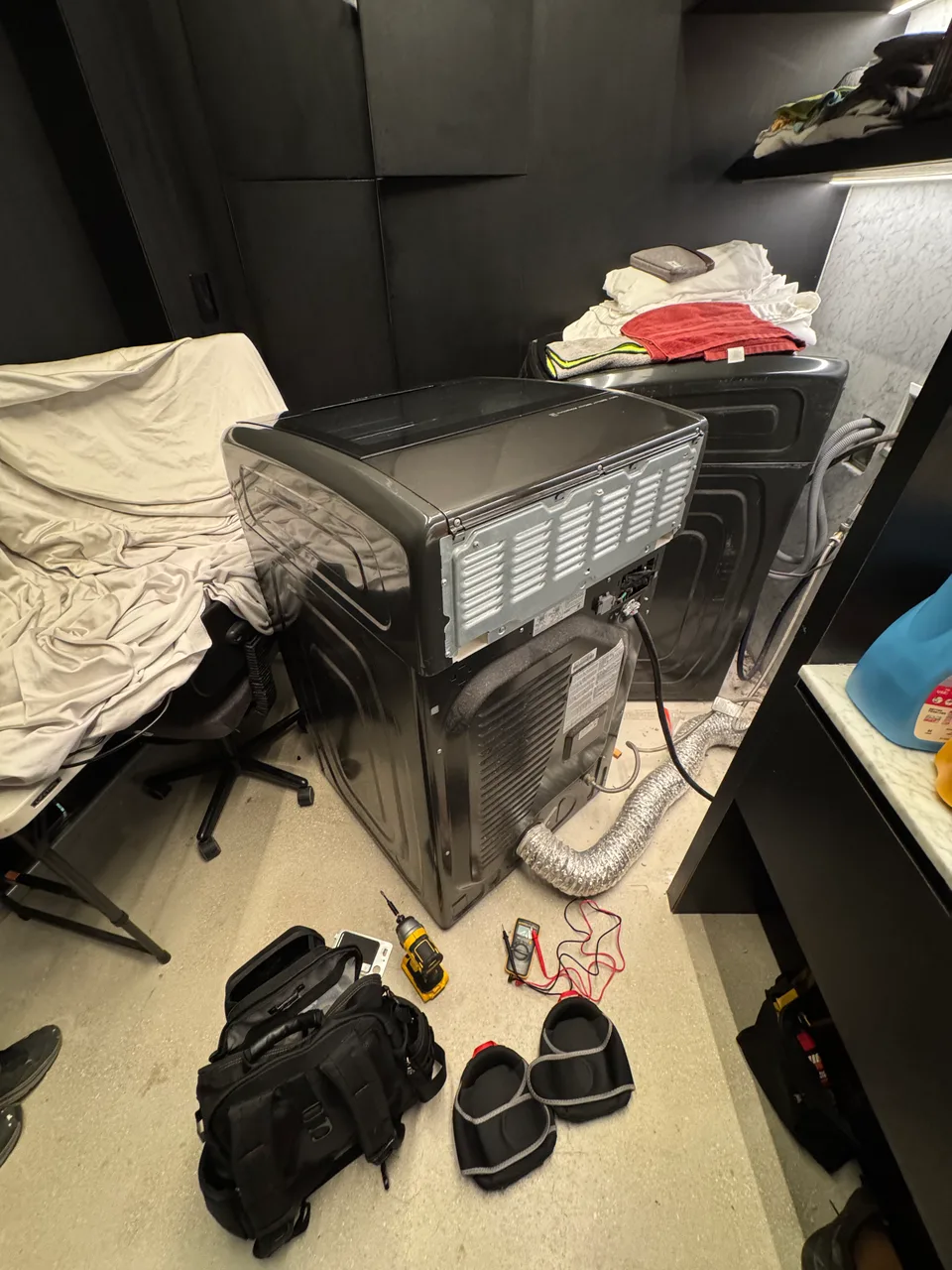 Dryer laid on its side with the top open to reach the thermistor