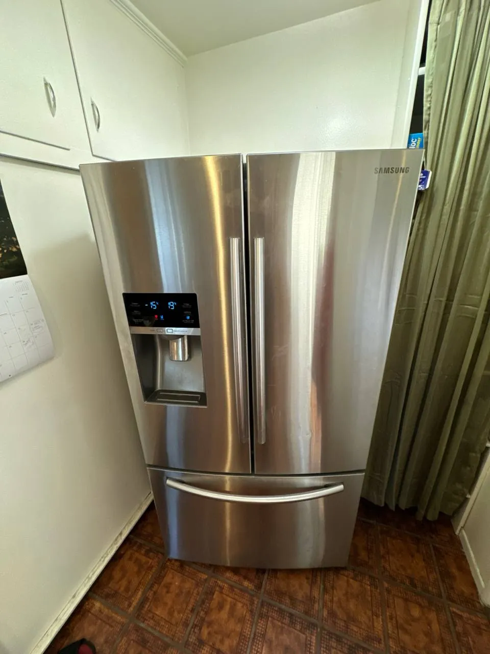 Samsung french-door refrigerator with the water and ice dispenser in the door