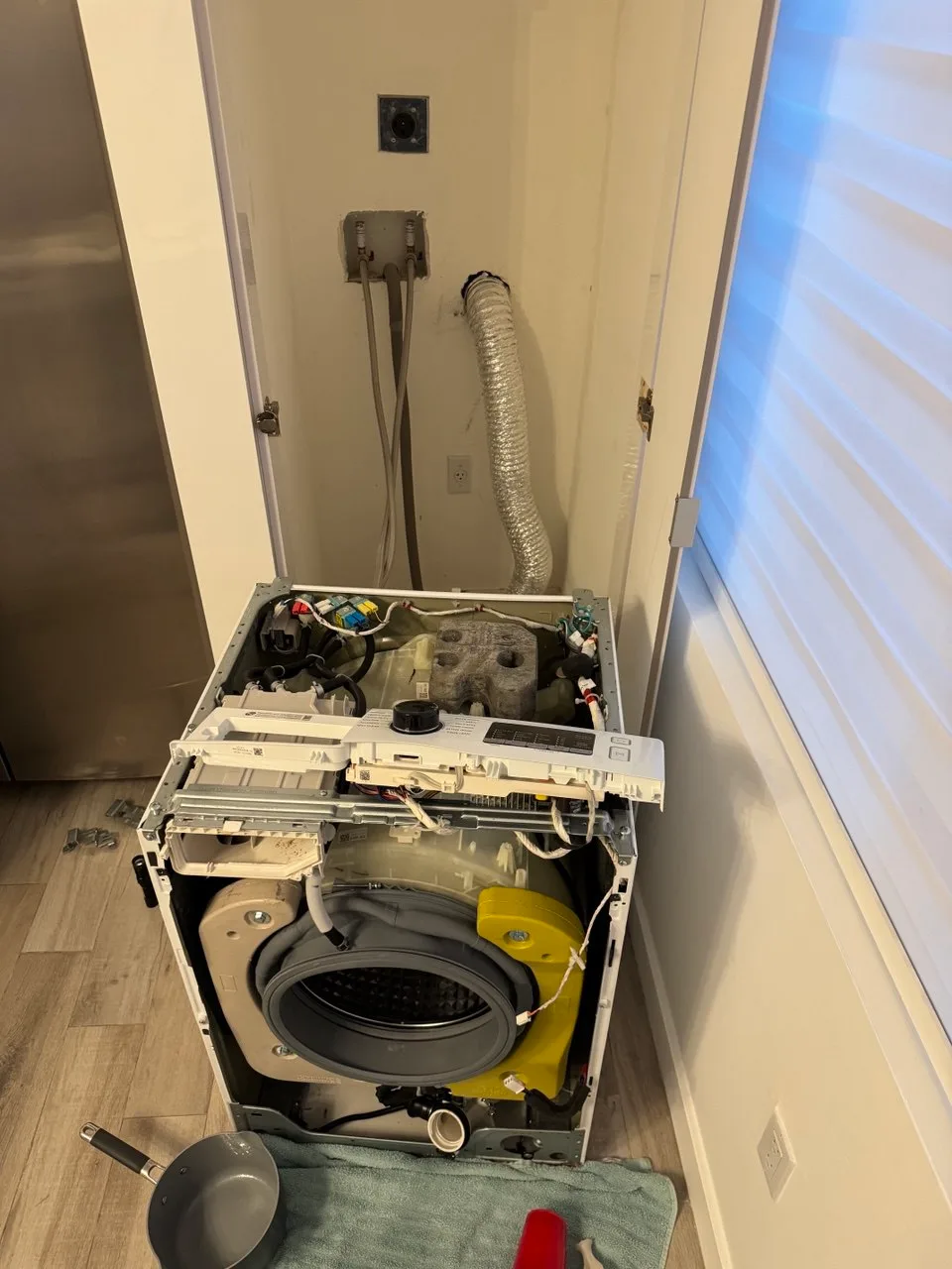 Disassembled front-load washer with the door seal exposed