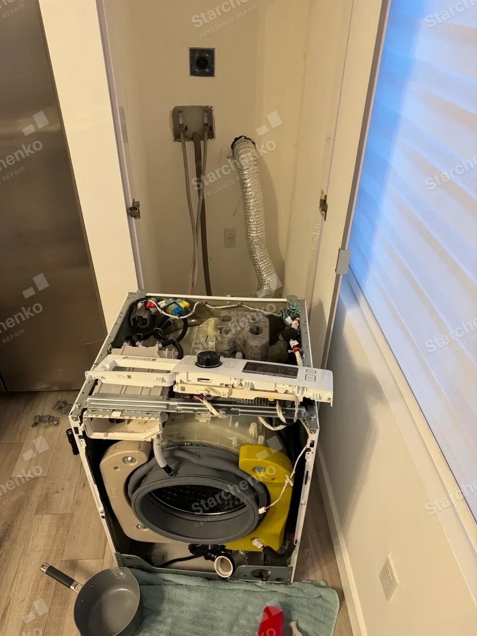 Disassembled front-load washer with the door seal exposed