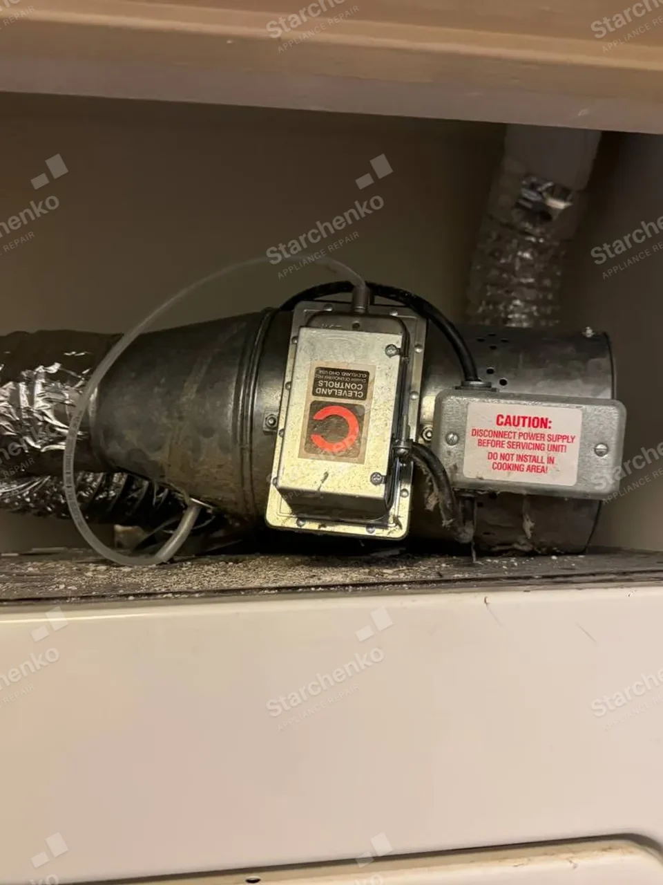 Kenmore dryer exhaust booster fan fitted on the vent duct above the machine