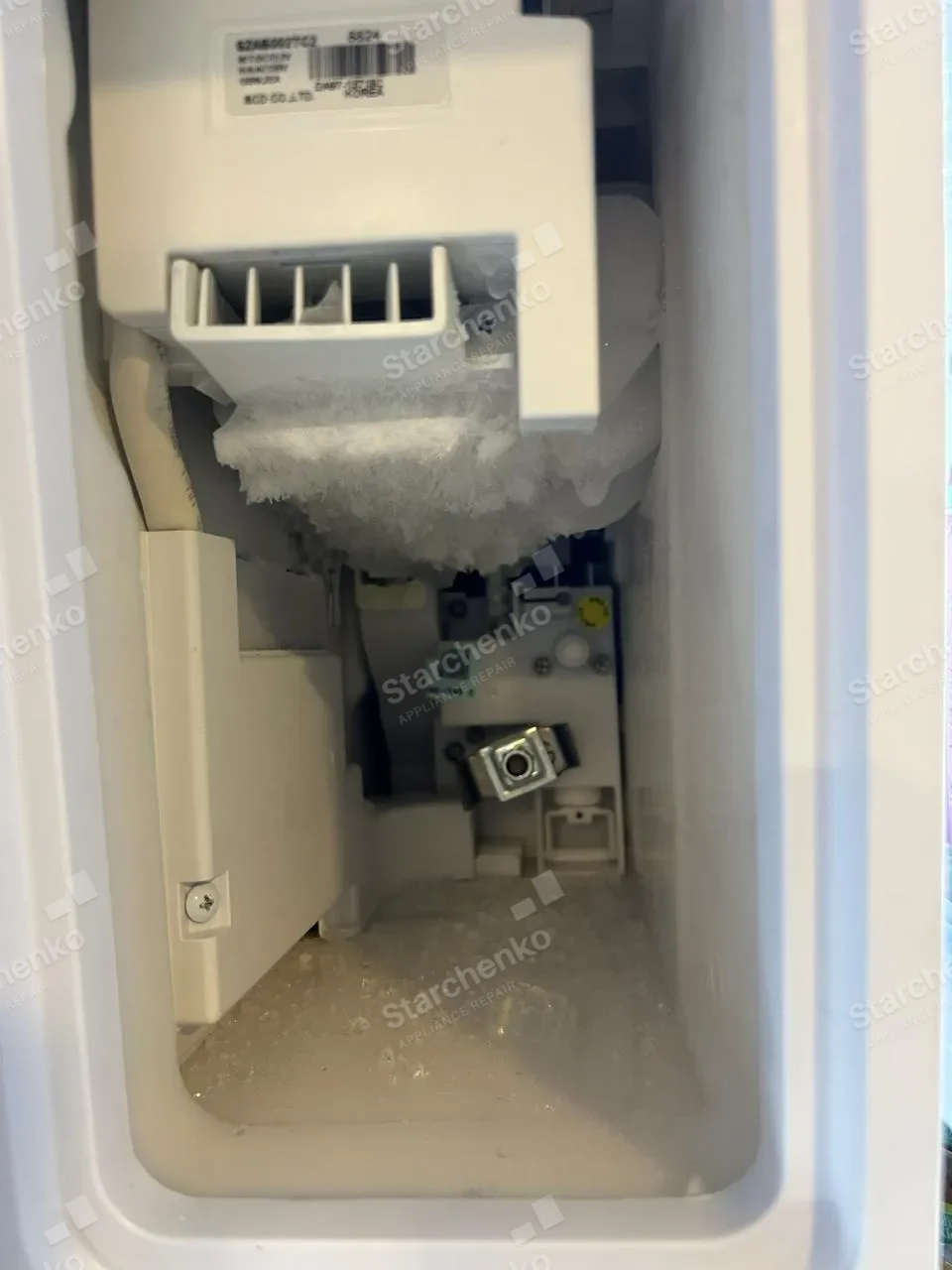 Samsung refrigerator freezer compartment opened around the ice maker