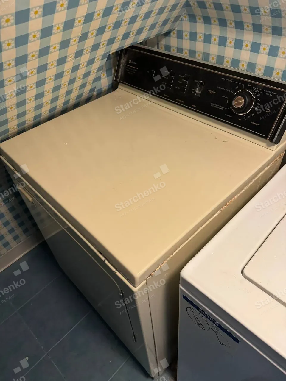 Vintage Maytag dryer with a black control panel beside a top-load washer