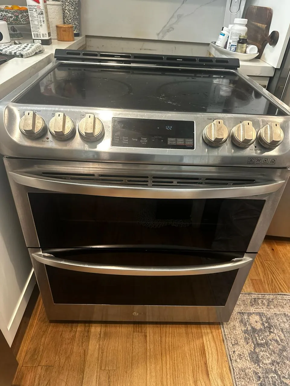 Stainless LG double-oven range with a black glass cooktop