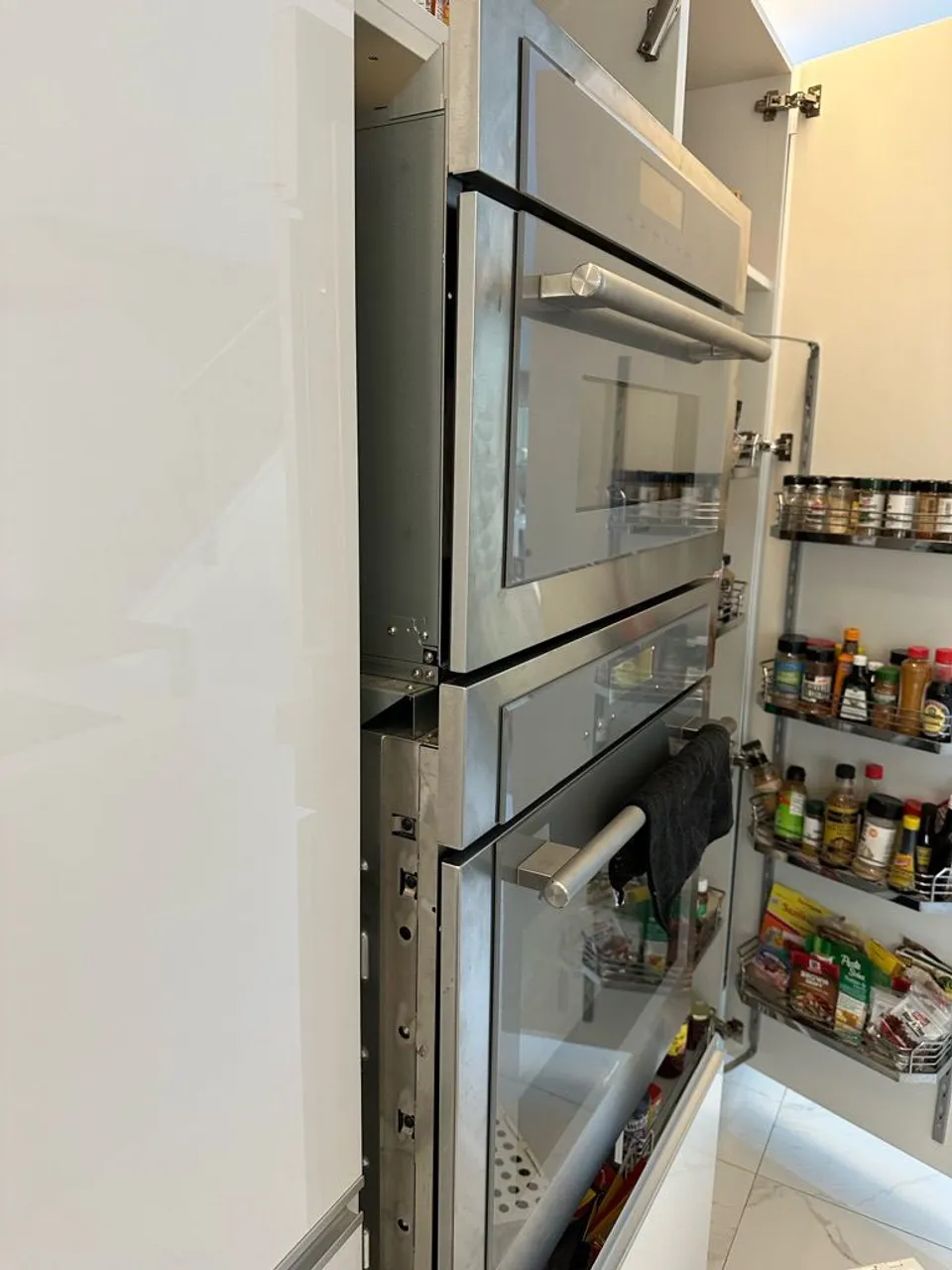 Thermador double wall oven built into a kitchen cabinet