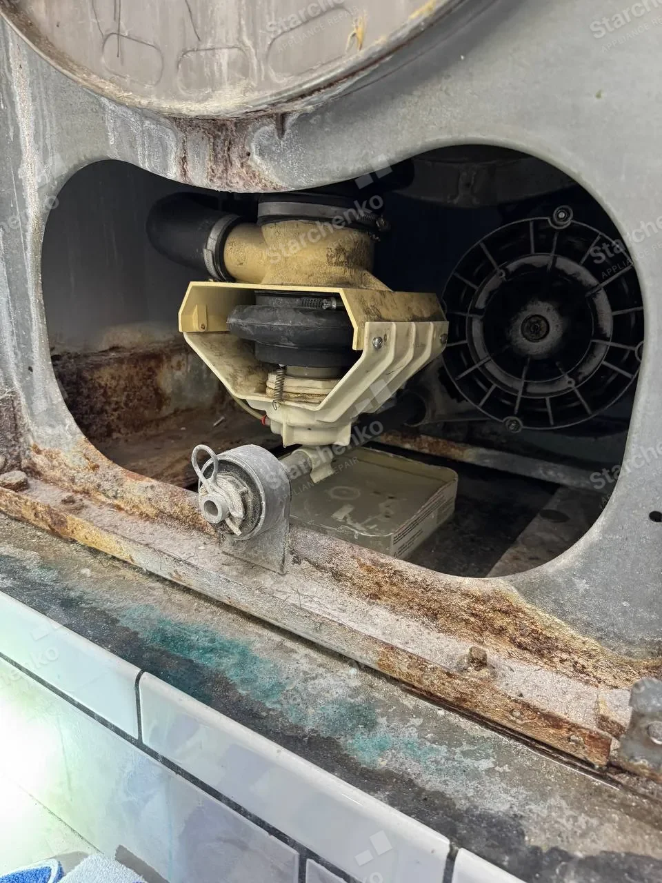 Alliance Laundry Systems commercial washer opened during a drain pump replacement