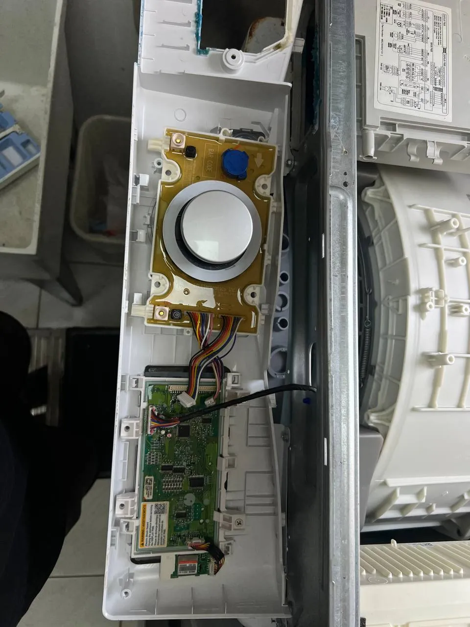Asko washer with its control panel open and user interface board exposed