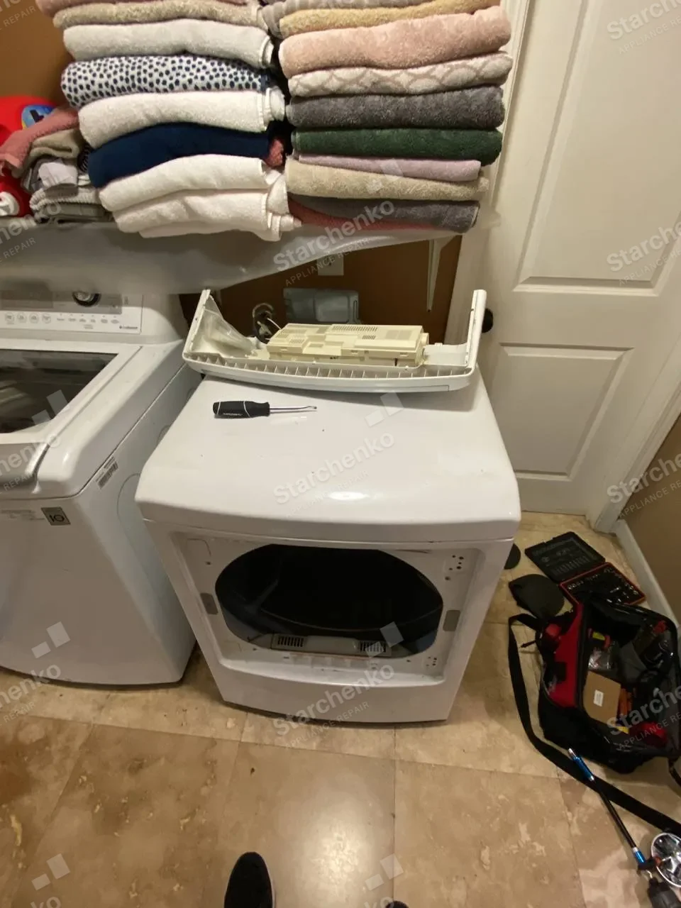 Kenmore dryer with the control board exposed during repair