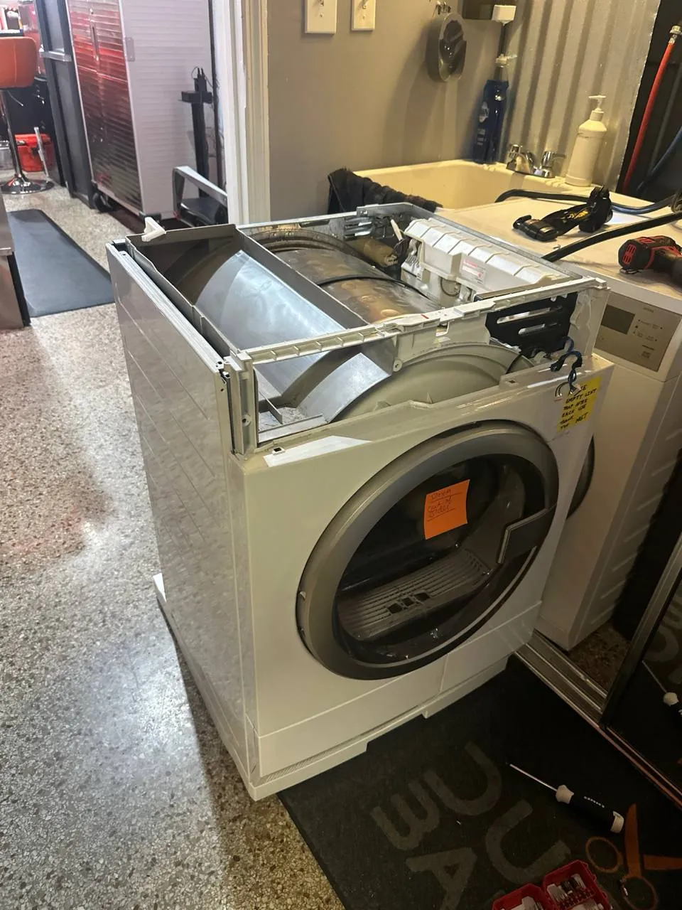 Electrolux dryer pulled forward and opened during a user interface board replacement