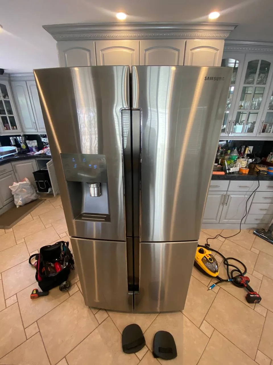 Samsung French-door refrigerator pulled out during a drain line cleaning