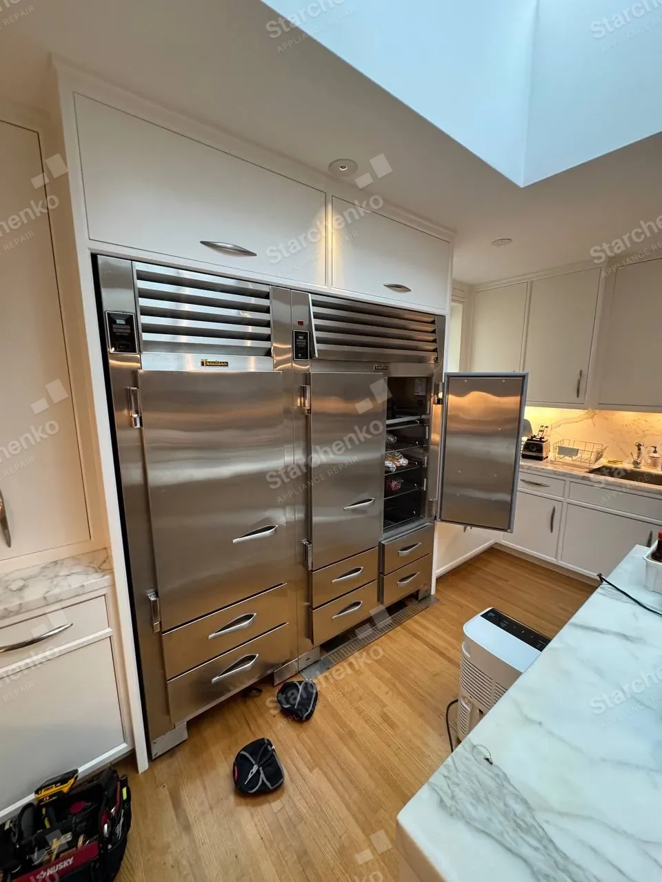 Traulsen refrigerator columns in a kitchen during an evaporator fan replacement