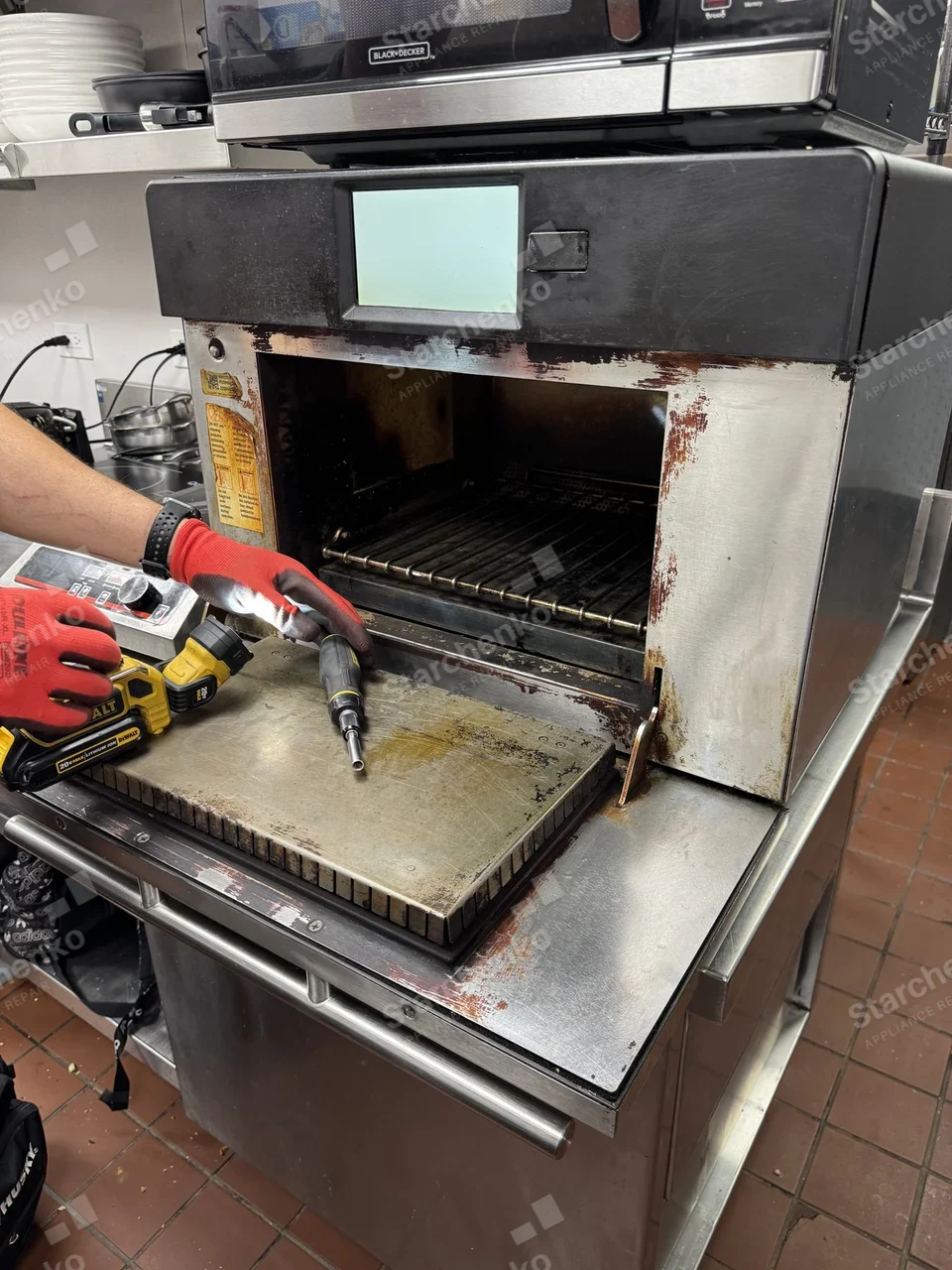 TurboChef speed oven in a restaurant kitchen with the door lowered during service