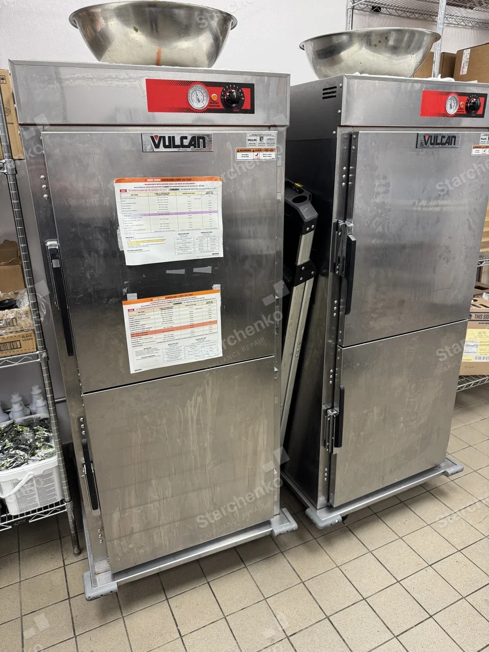 Two Vulcan heated holding cabinets in a restaurant kitchen