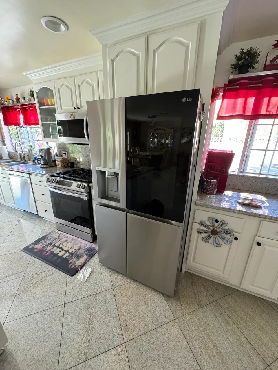 LG InstaView refrigerator in a white kitchen