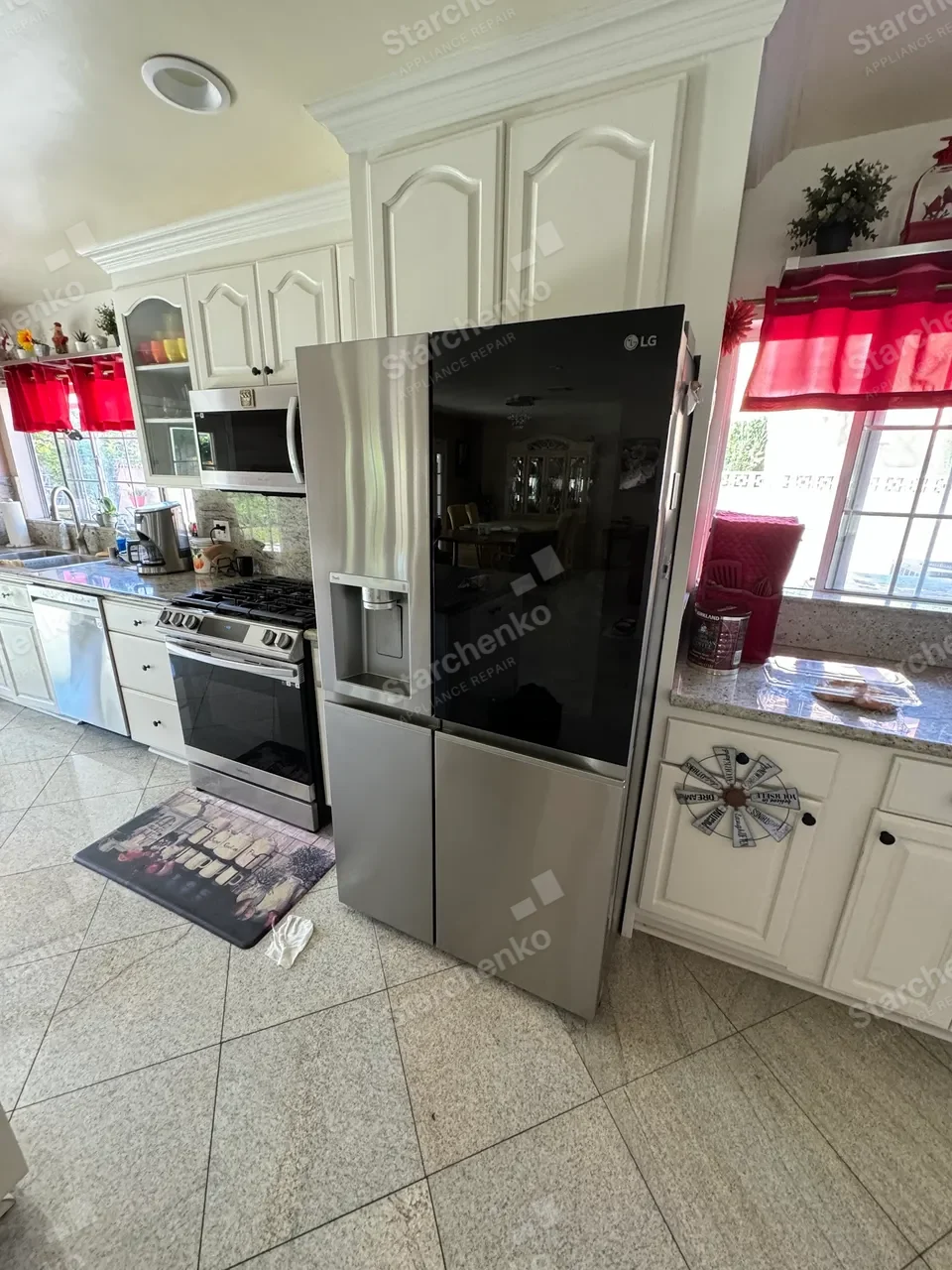 LG InstaView refrigerator in a white kitchen