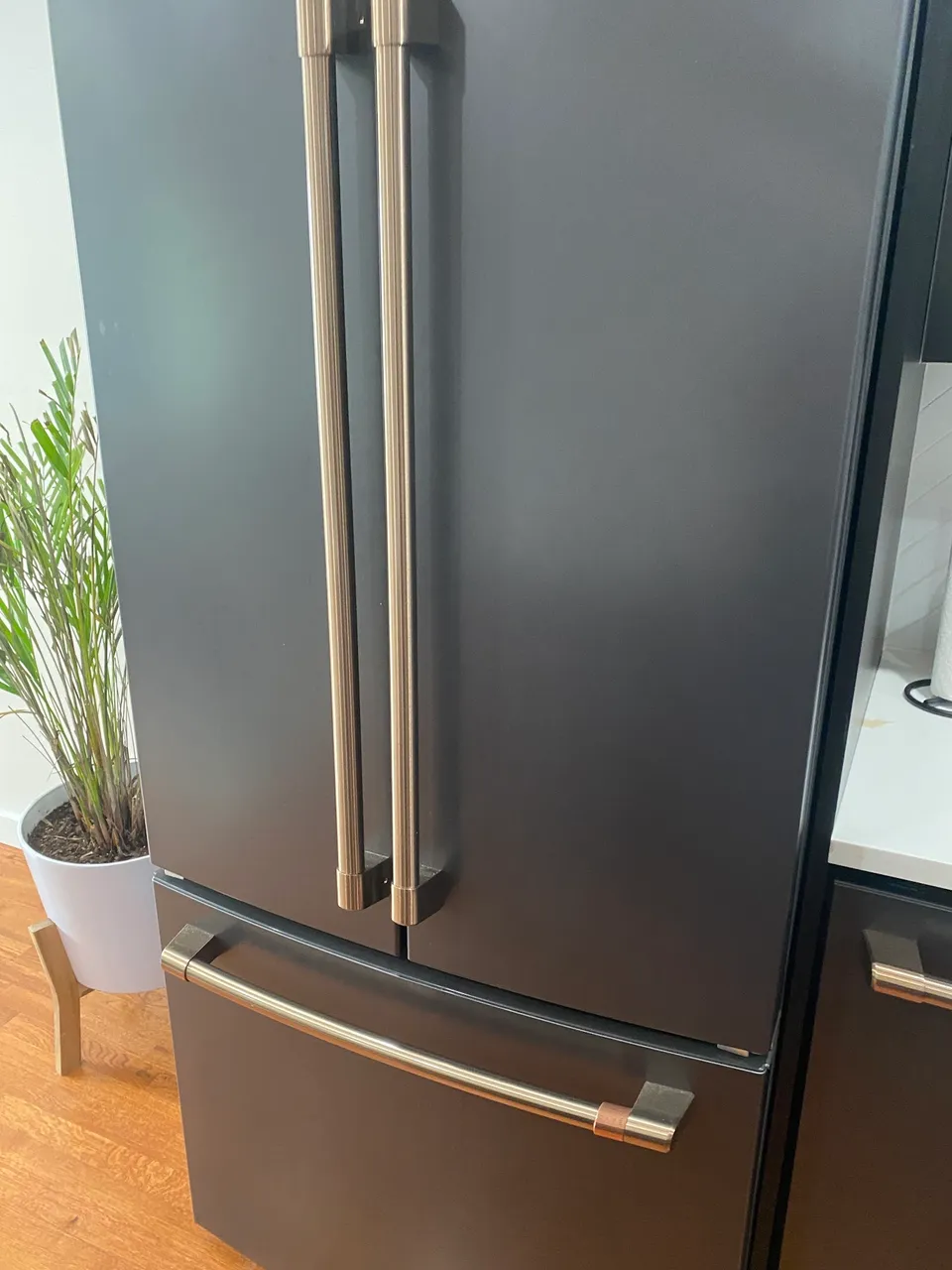 Matte graphite French-door refrigerator in a bright kitchen