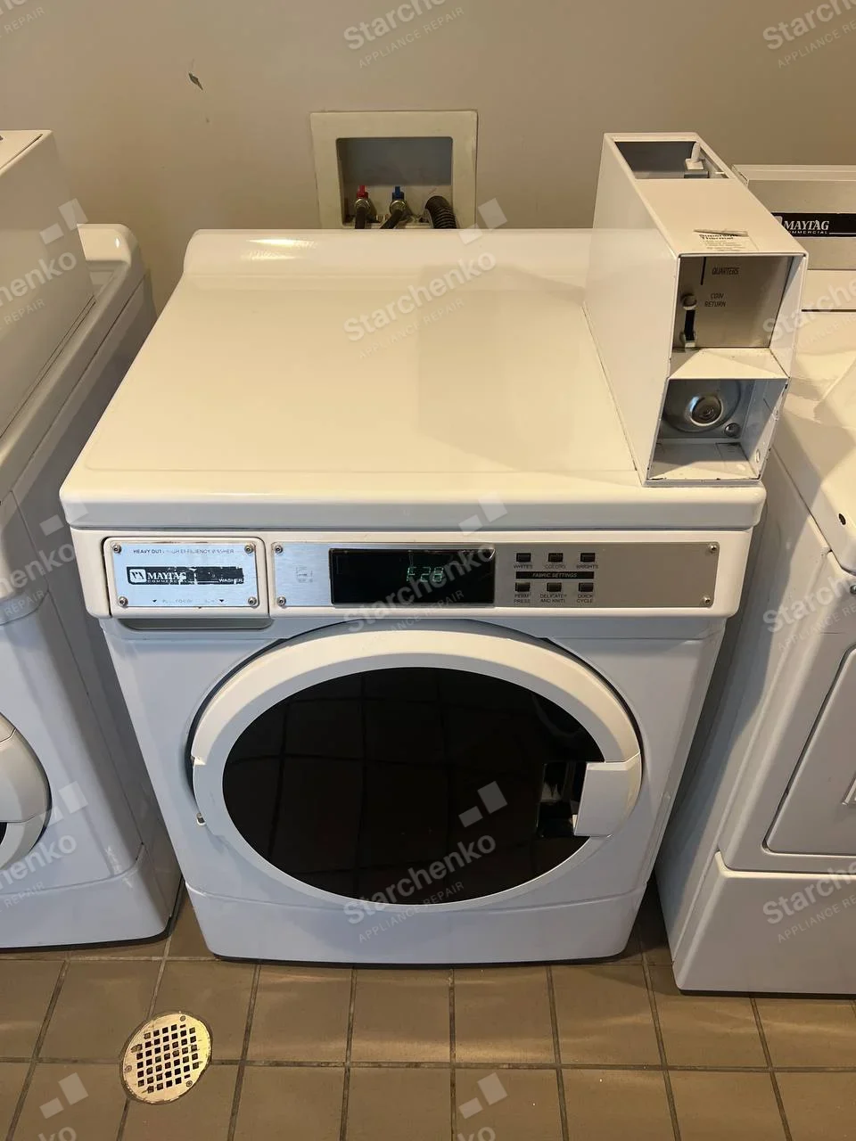 Maytag Commercial repair: Maytag coin-operated front-load dryer showing F28 on display with open coin mechanism.