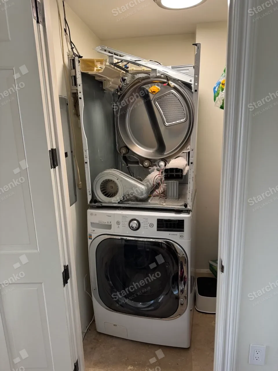 Stacked LG unit with the dryer opened and the blower removed