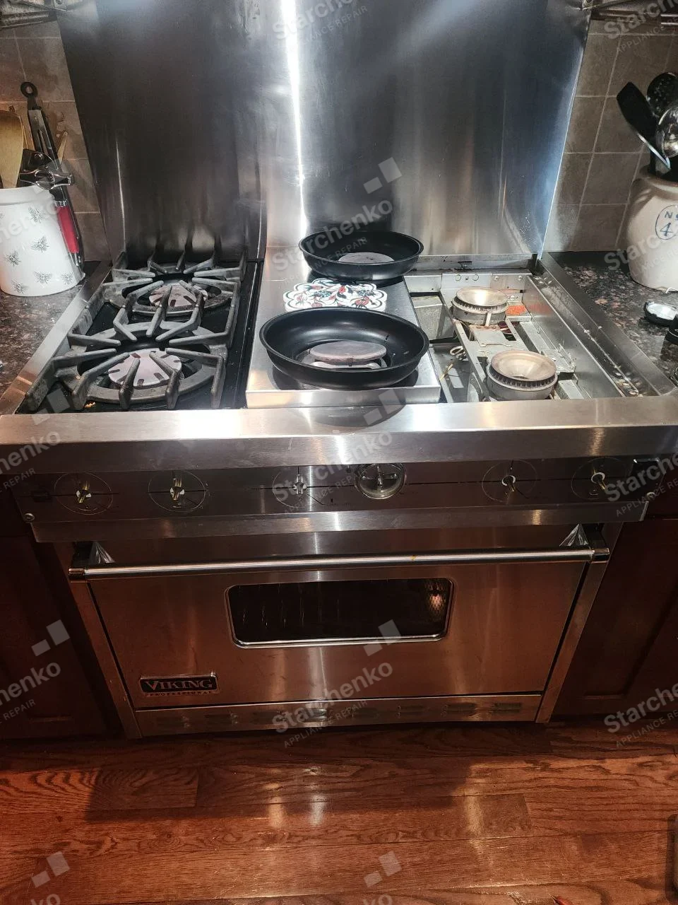 VIKING Professional badge on lower-left oven door of gas range, right-side burner tray removed.
