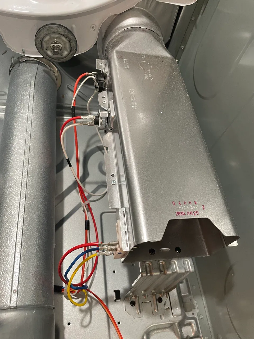 Dryer heating element housing with its thermostats, opened for replacement