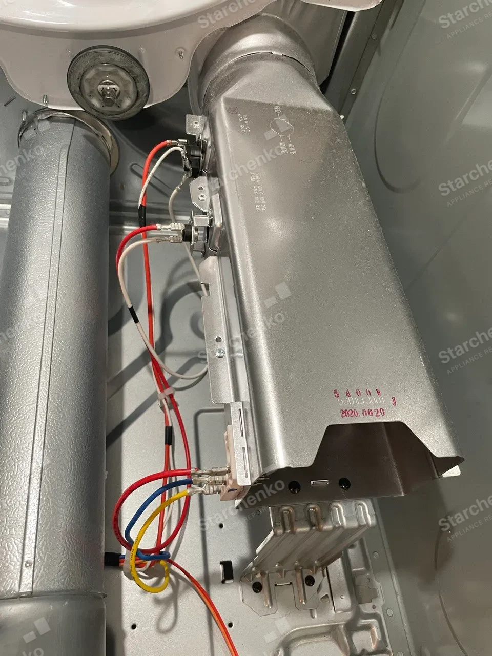 Dryer heating element housing with its thermostats, opened for replacement
