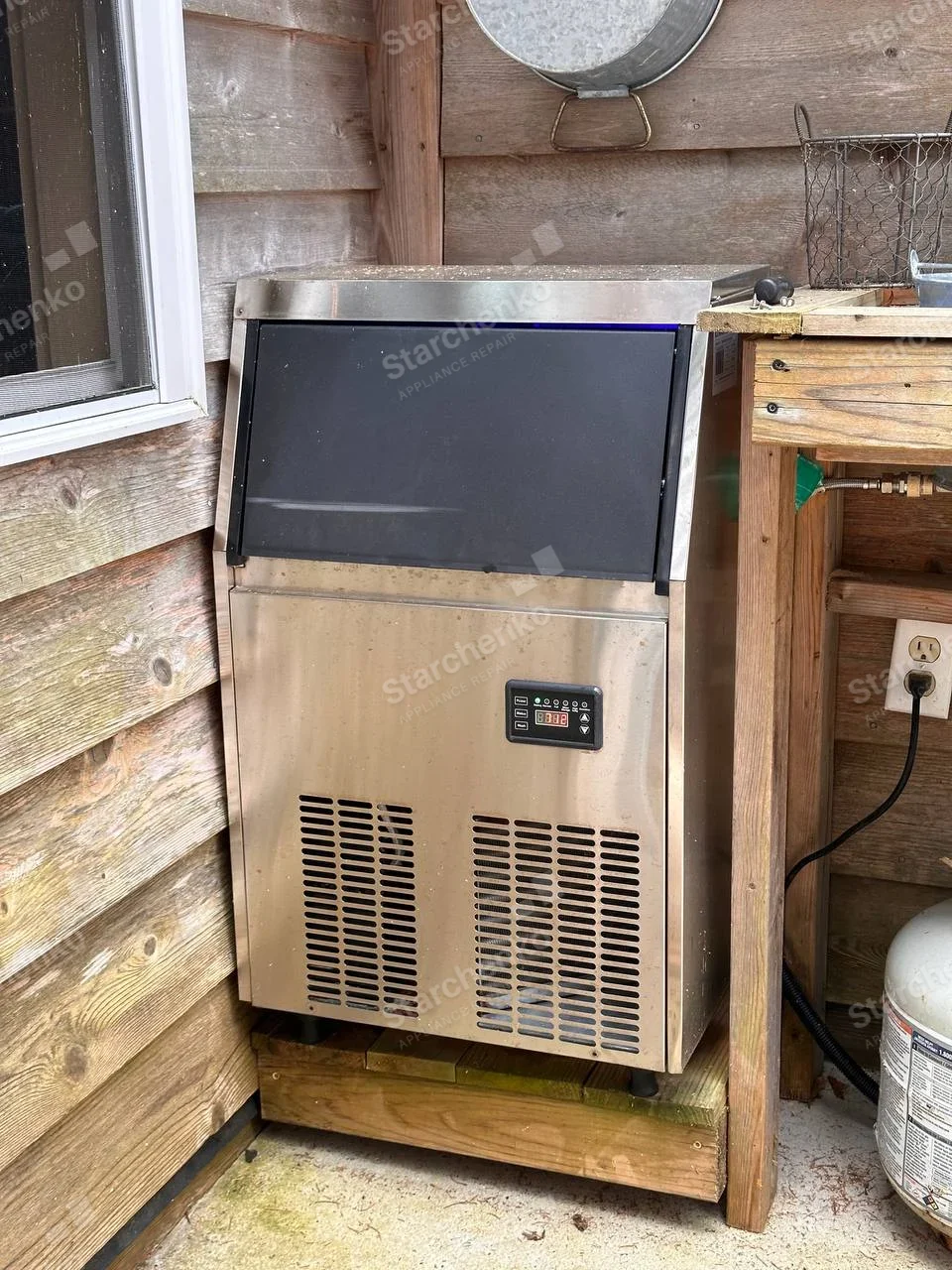 Kold-Draft repair: Stainless self-contained commercial ice machine with black upper bin door and digital control.