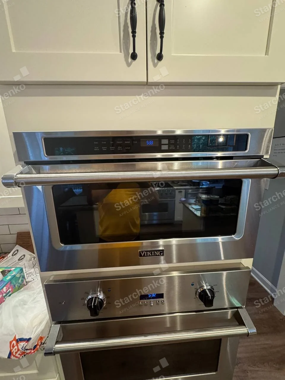 VIKING name centered on front of upper unit in built-in oven stack, lower oven directly below.