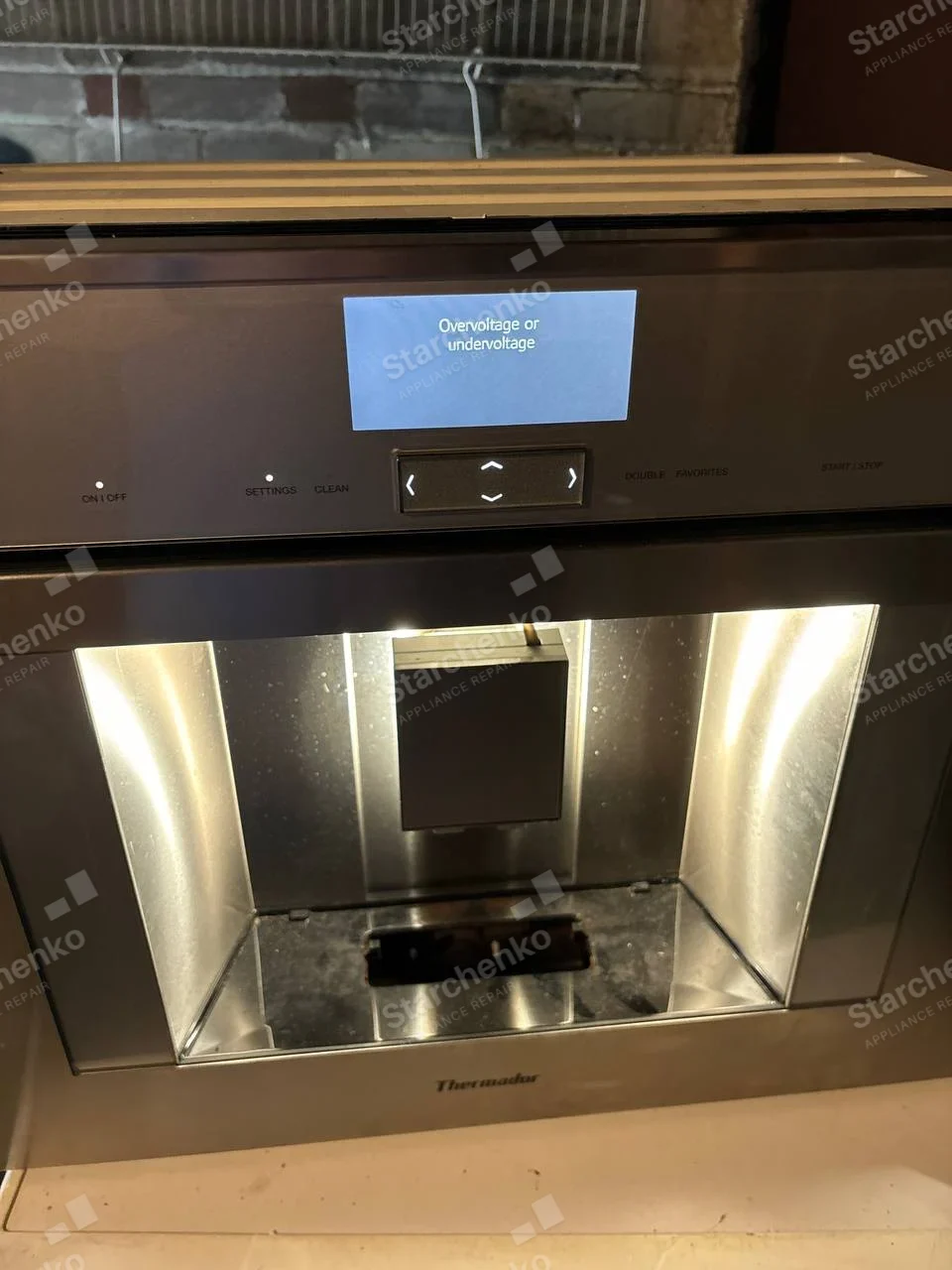 Thermador repair: Refrigerator door dispenser shows electrical overvoltage or undervoltage message.