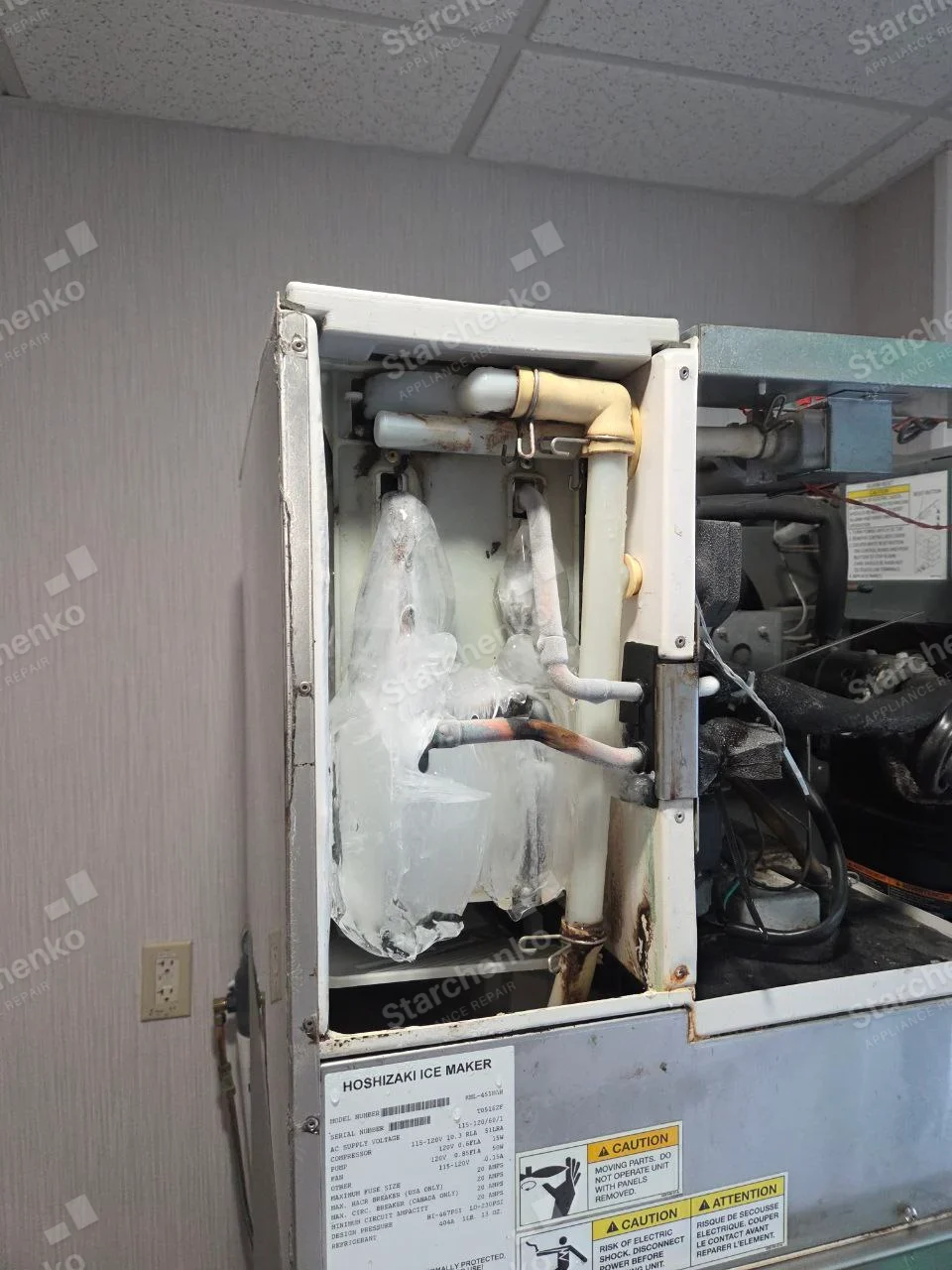HOSHIZAKI ICE MAKER on factory rating label fixed to opened ice-making unit, ice buildup around evaporator.