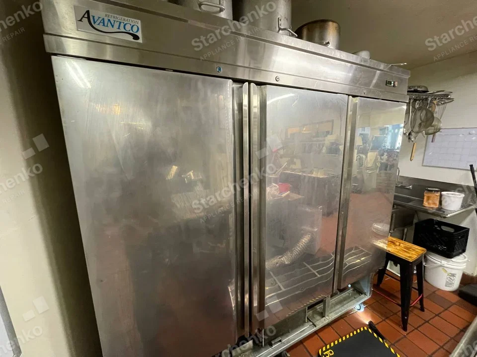 Avantco Refrigeration badge above three tall stainless doors in commercial kitchen.