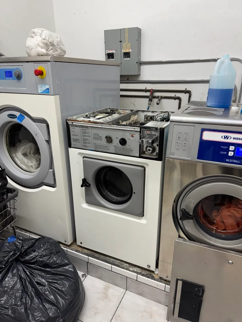 Wascomat commercial washer with the top panel removed
