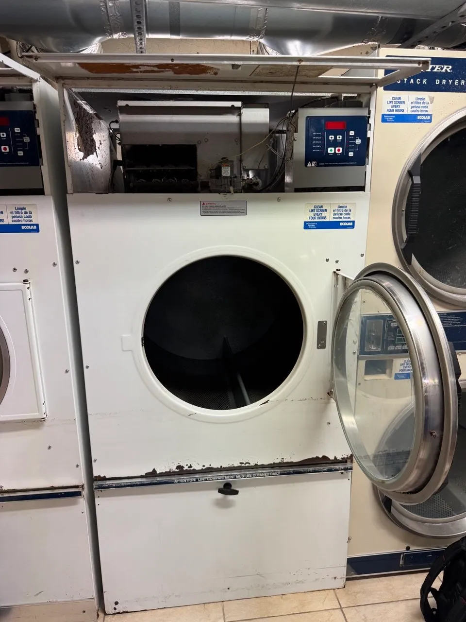 Dexter commercial dryer with the top panel removed and internal components visible