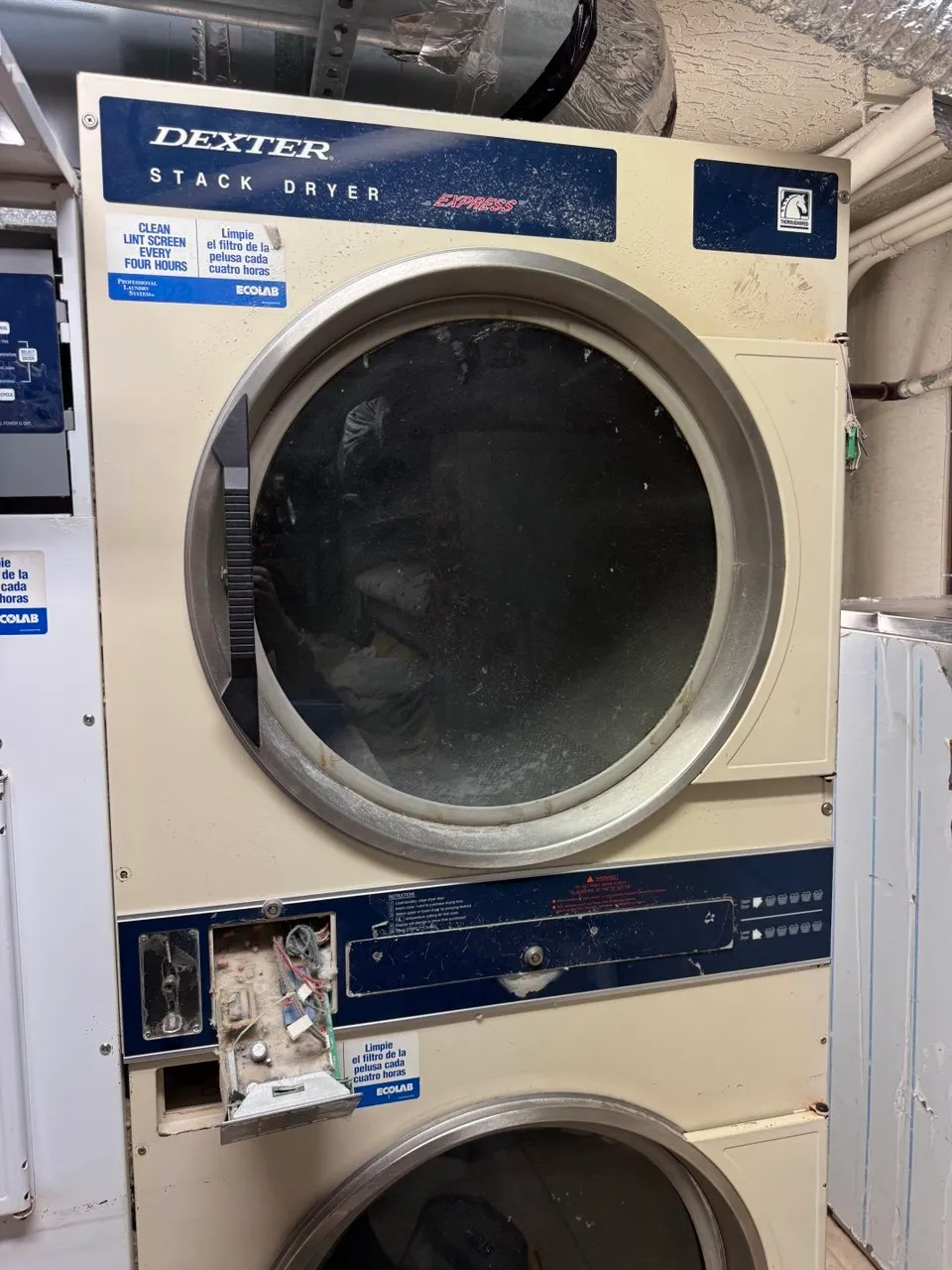 Dexter commercial dryer with the lower service panel open